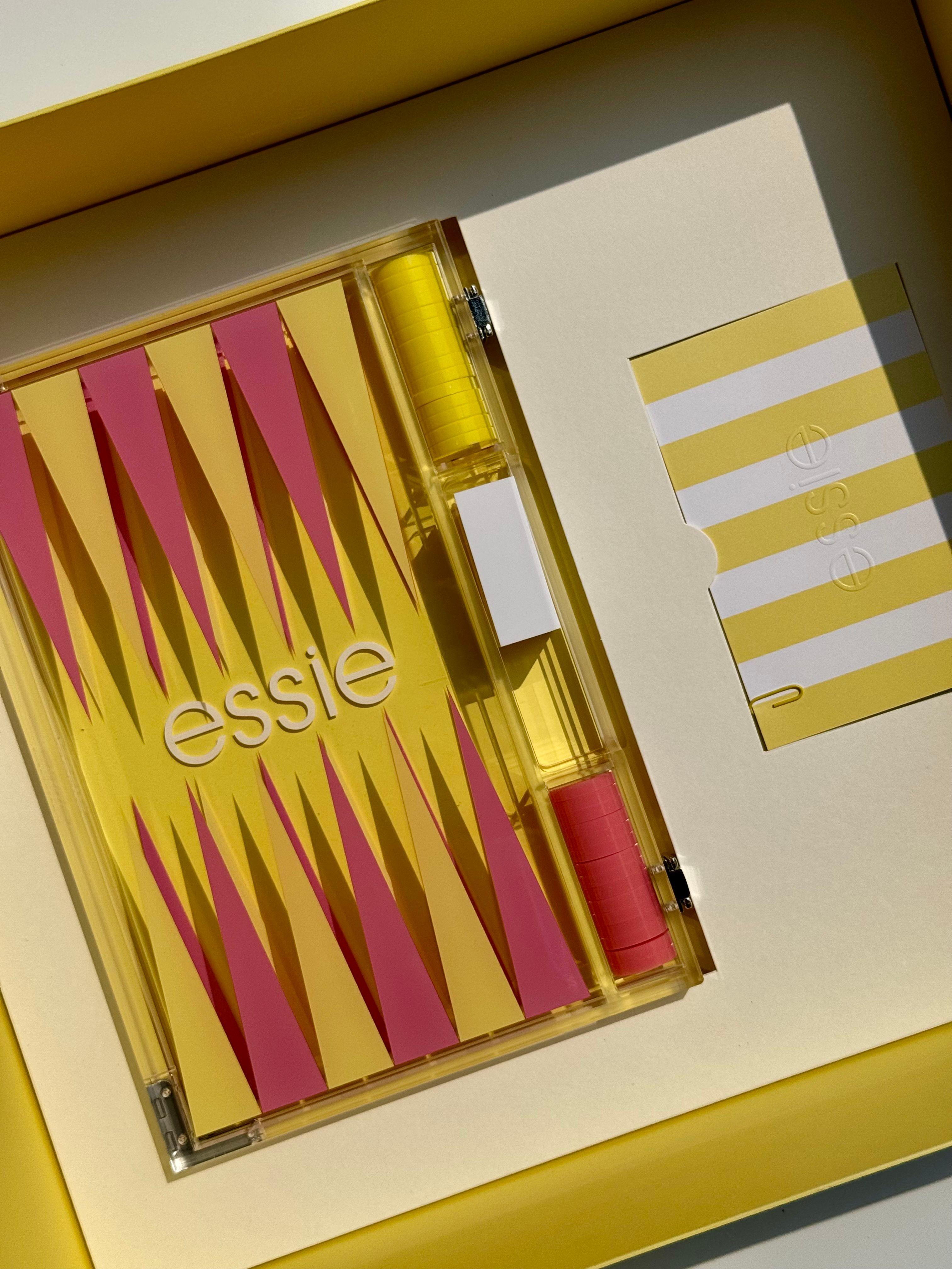 Essie summer Riviera Rush nail polish collection within ice cream boxes with backgammon set and branded newspaper