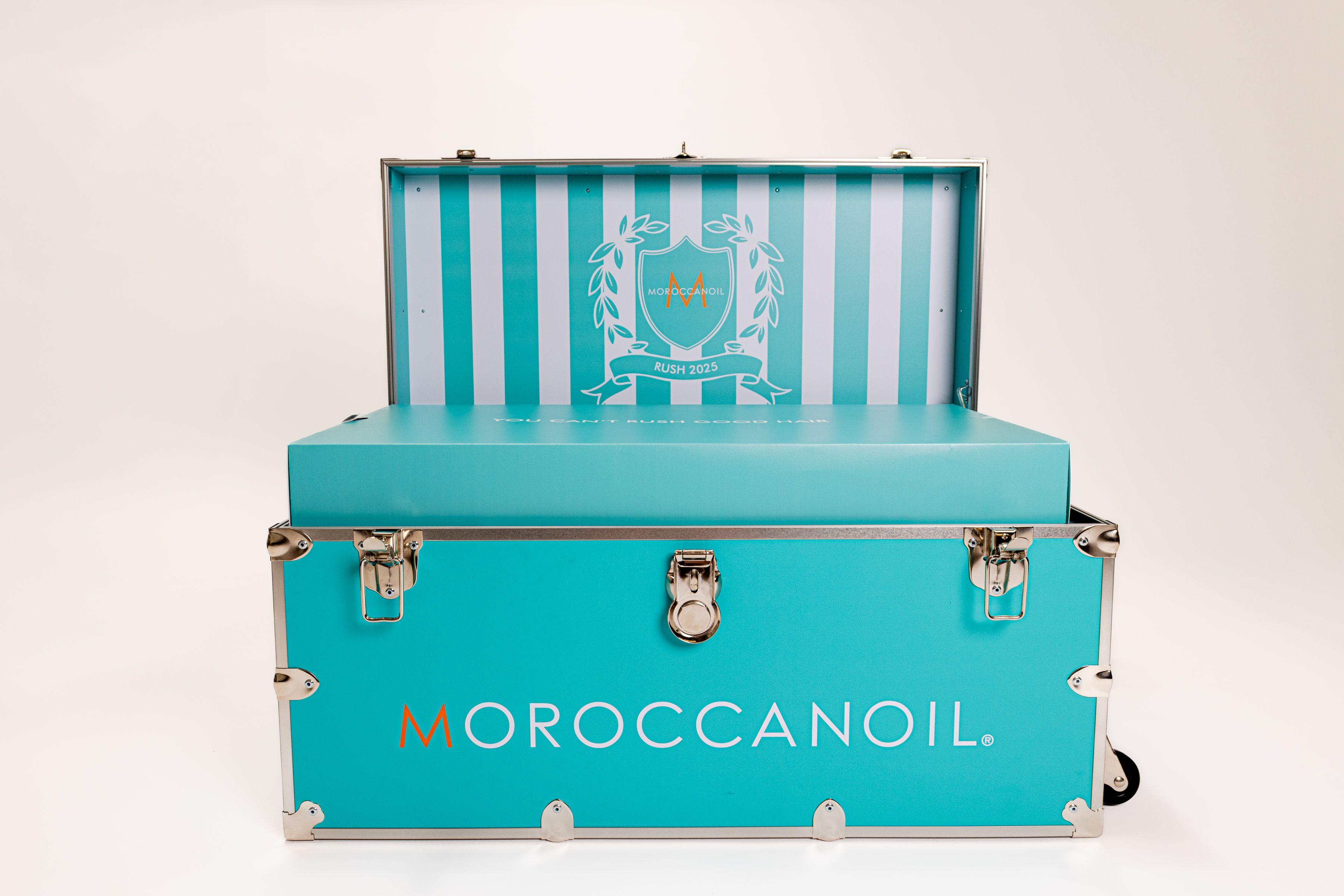 Moroccan Oil turquoise blue trunk with product for sorority rush campaign