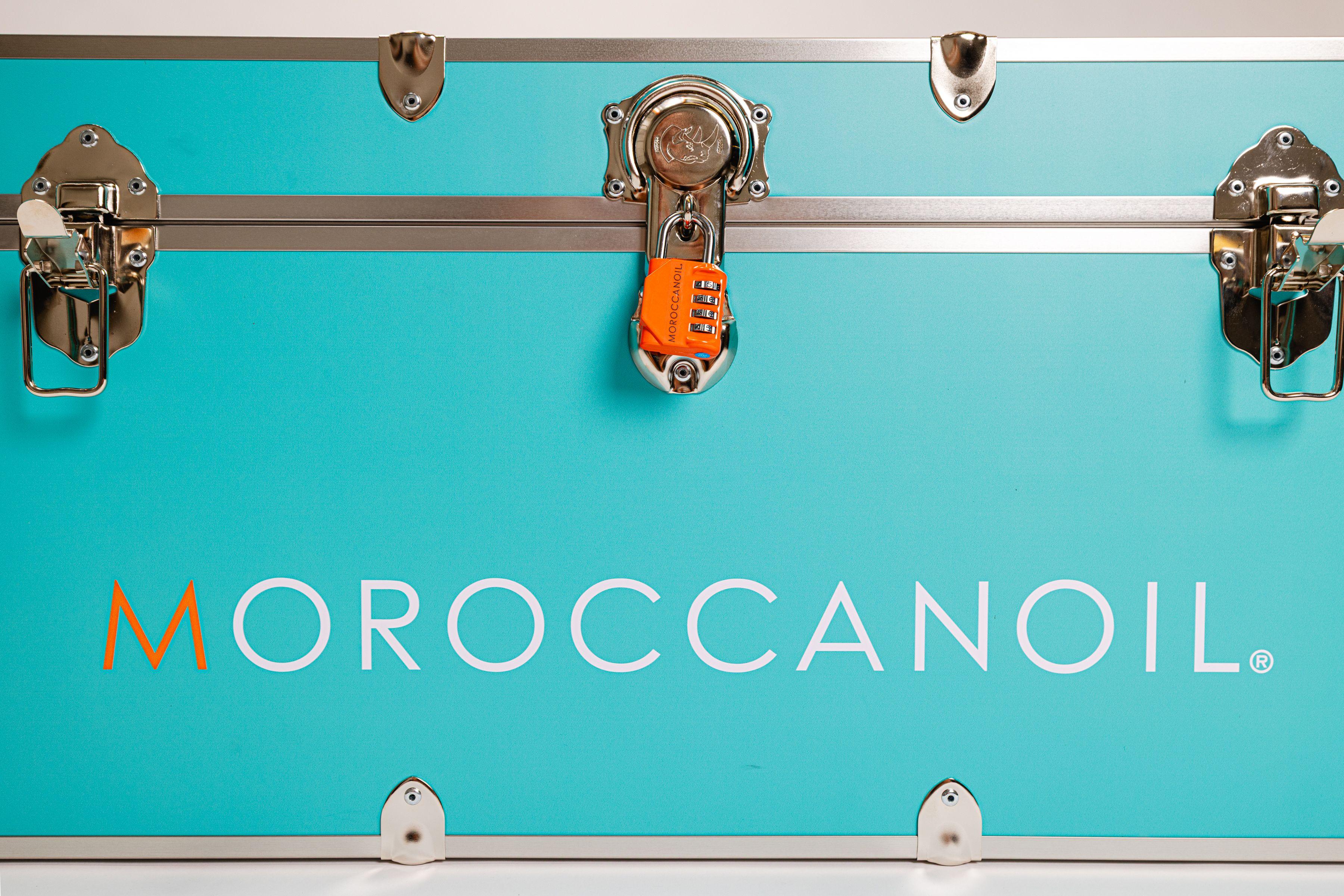 Moroccan Oil turquoise blue trunk with product for sorority rush campaign