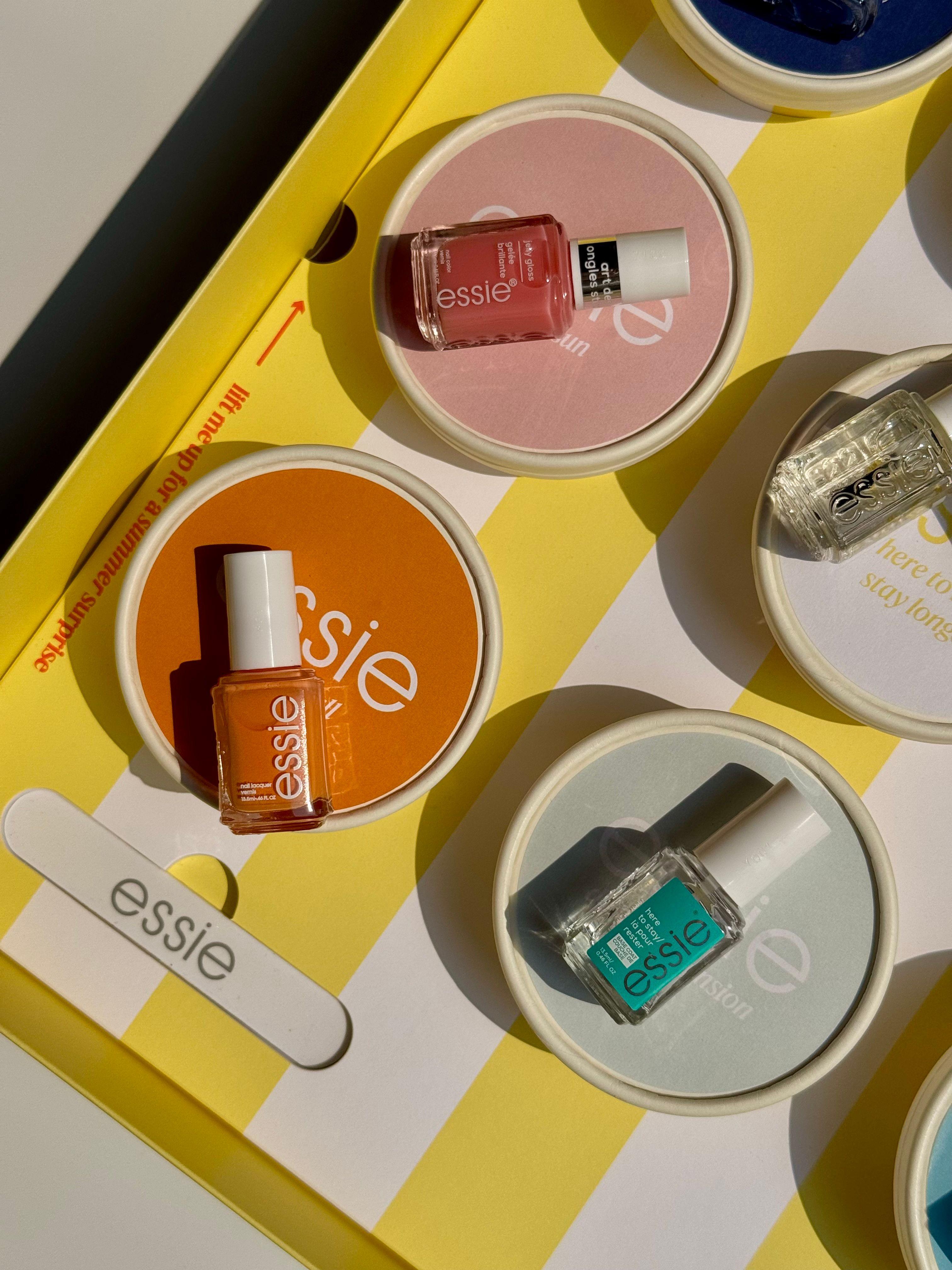 Essie summer Riviera Rush nail polish collection within ice cream boxes with backgammon set and branded newspaper