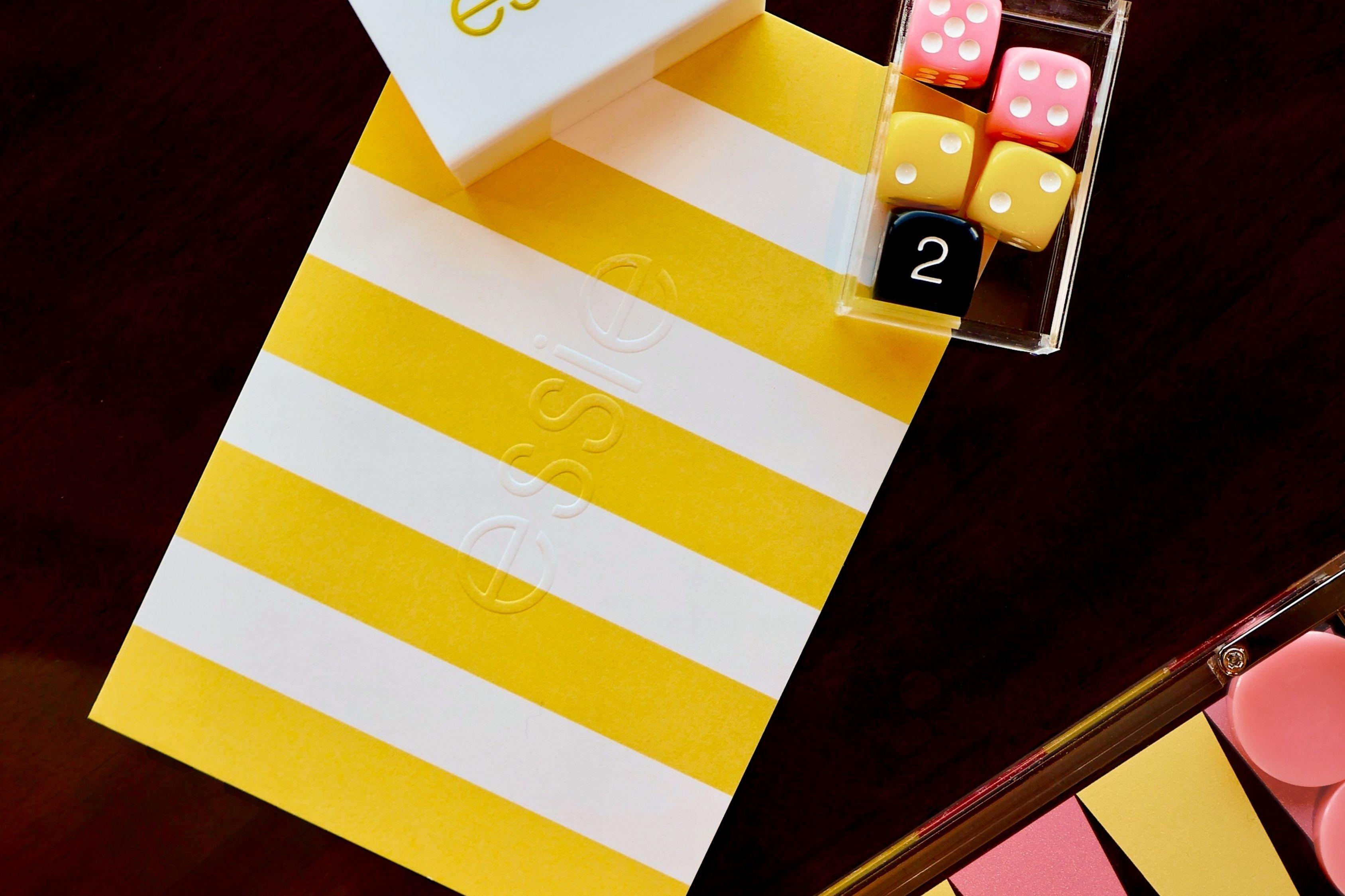 Essie summer Riviera Rush nail polish collection within ice cream boxes with backgammon set and branded newspaper