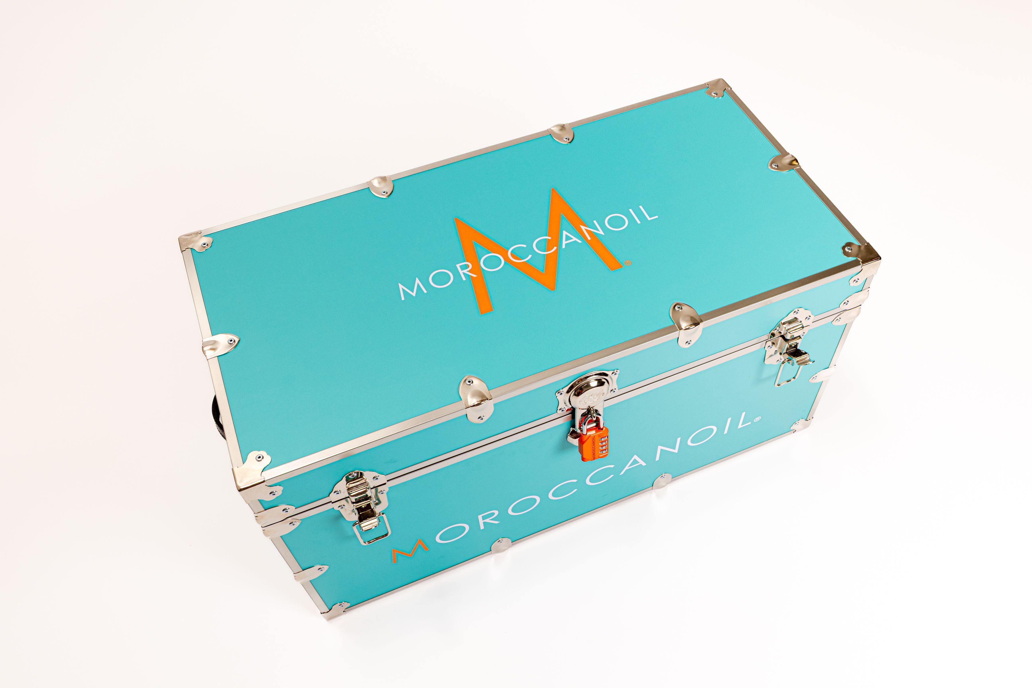 Moroccan Oil turquoise blue trunk with product for sorority rush campaign
